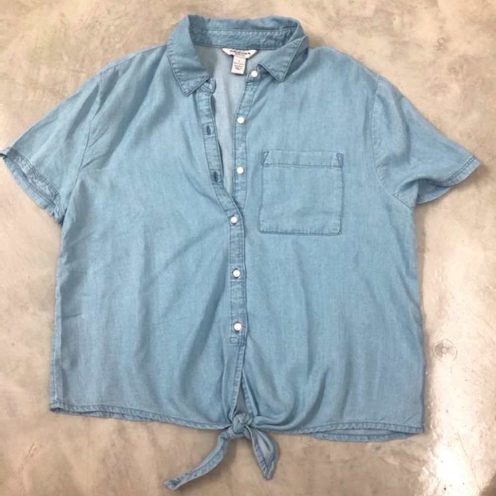 light blue denim shirt. tied at the bottom